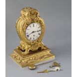 Vuilliamy, London. A 19th century French ormolu mantel timepiece, with heavy cast foliate scroll and