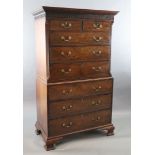 A George III mahogany chest on chest, with dentil cornice, blind fretwork frieze, two short and