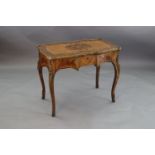 A late 19th century French ormolu mounted walnut, rosewood and marquetry writing table, with