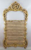 A 19th century giltwood overmantel mirror frame, carved with acanthus scroll, vines and flowers,