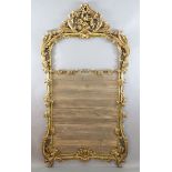 A 19th century giltwood overmantel mirror frame, carved with acanthus scroll, vines and flowers,