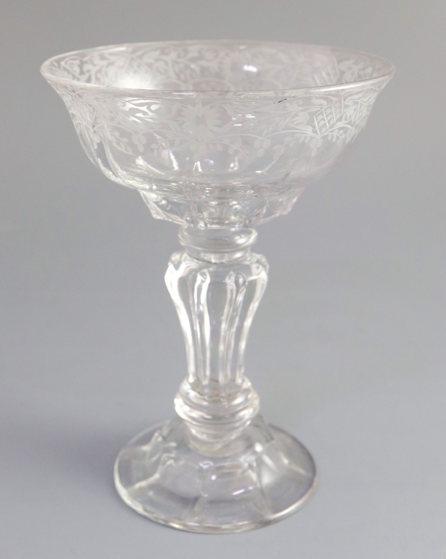 A George II Silesian stem sweetmeat glass, c. 1740, the panel moulded ogee shaped bowl wheel