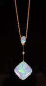 An early 20th century 15ct gold, diamond and two stone opal set drop pendant necklace, pendant 50mm,