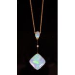 An early 20th century 15ct gold, diamond and two stone opal set drop pendant necklace, pendant 50mm,