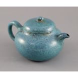 A Chinese Yixing robin's-egg glazed compressed globular teapot and cover, Qing dynasty, impressed