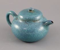 A Chinese Yixing robin's-egg glazed compressed globular teapot and cover, Qing dynasty, impressed