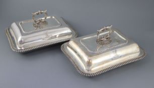 A pair of George IV silver rectangular entree dishes, with covers and handles, by William Bateman,