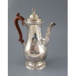 A modern 18th century style silver baluster coffee pot, by Spink & Son, with gadrooned borders and