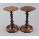 A pair of George III mahogany and ebony adjustable candle stands, with telescopic stems height 8.