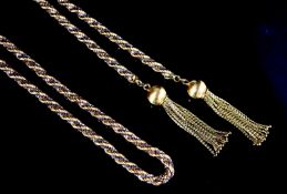 A 1970's 18ct. two colour gold ropetwist sautoir necklace, with demi-lune clip and tassel terminals,