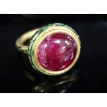 An antique Mogul gold, green enamel and cabochon natural red spinel set ring, with GCS report