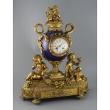 Vernet, Rue du Bac 42. A 19th century French ormolu and bleu du roi porcelain mantel clock, of urn