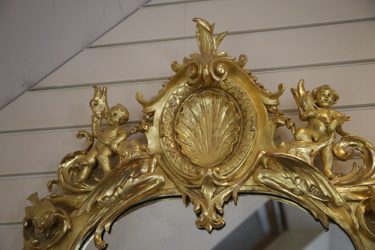 A pair of 19th century French carved giltwood wall mirrors, with scallop and scroll crests flanked - Image 3 of 5