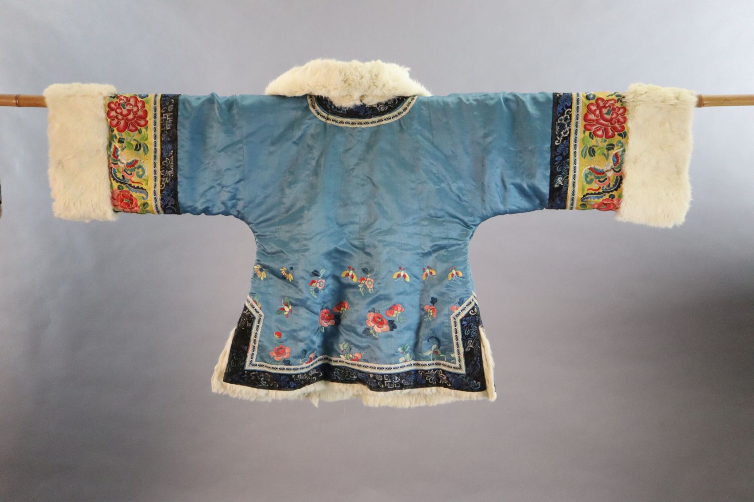 A Chinese embroidered silk winter jacket, late 19th/early 20th century, with white fur lining, - Image 2 of 2