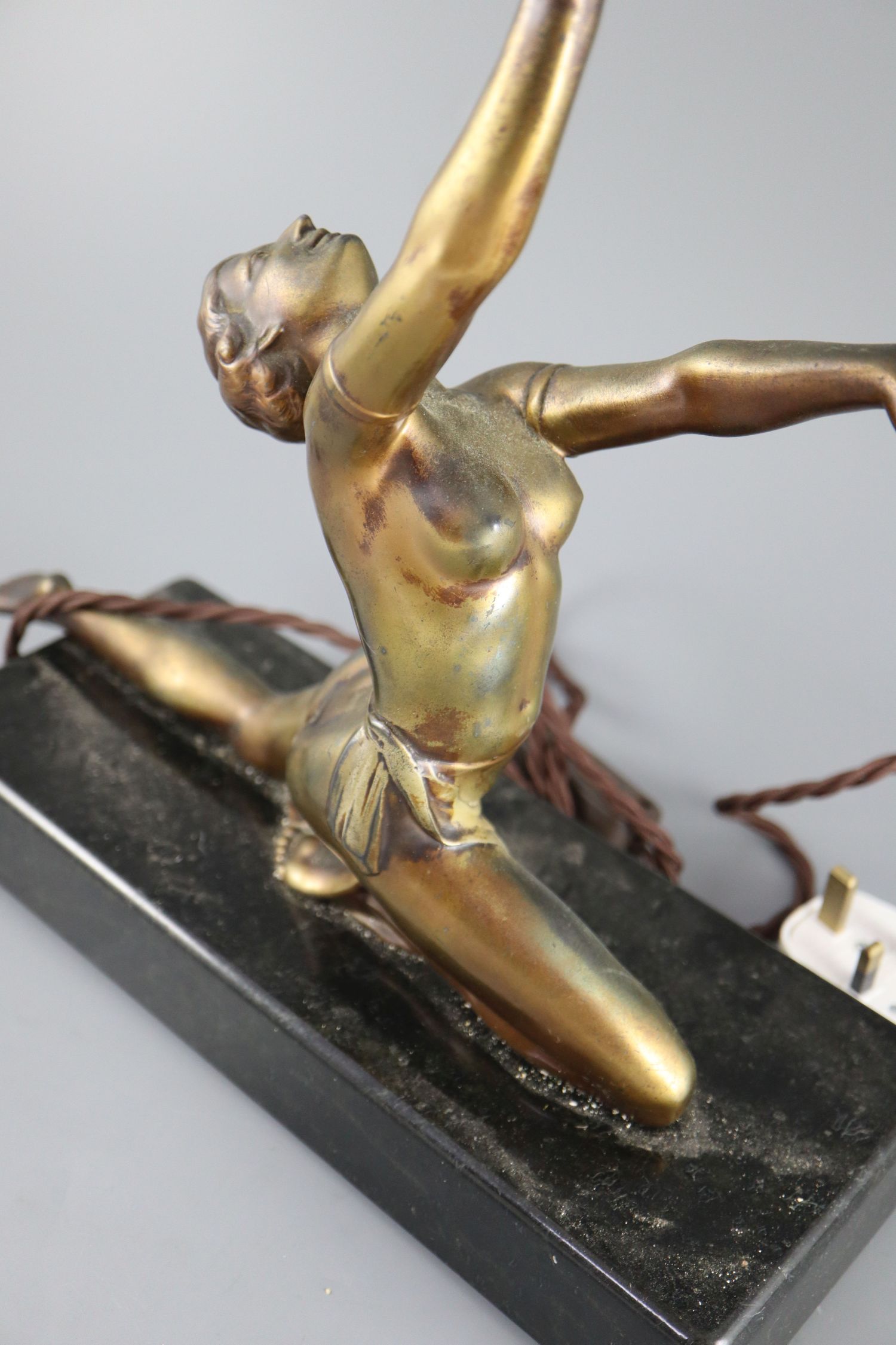 A French Art Deco bronzed spelter table lamp, modelled as a kneeling dancer holding aloft a - Image 2 of 3