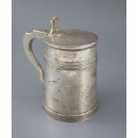 An early 19th century Anglo-Indian silver tankard, with reeded bands and pierced thumbpiece, the