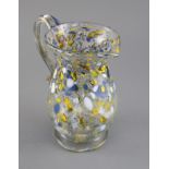 A George III yellow, blue and white marvered glass jug. c.1800, the applied scrolled handle with