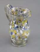 A George III yellow, blue and white marvered glass jug. c.1800, the applied scrolled handle with