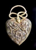 A Victorian gold and gem set heart shaped mourning pendant, with hinged serpent finial, with foliate