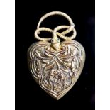 A Victorian gold and gem set heart shaped mourning pendant, with hinged serpent finial, with foliate