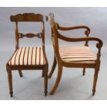 A set of ten William IV mahogany dining chairs including two carvers, with scroll carved frames