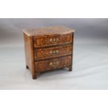 A French Regence olivewood and rosewood bowfront commode, c.1725, with parquetry decoration and
