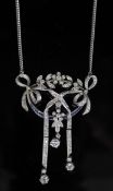 An early 20th century platinum, sapphire and diamond set articulated openwork drop pendant necklace,