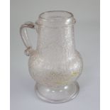 A Continental ice glass flagon, c.1600, possibly Antwerp, of baluster form, with plain applied