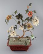 A Chinese jade and hardstone model of a tree, 19th century, comprising of nephrite, chalcedony and