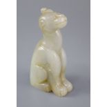 A Chinese pale celadon and russet jade figure of a mythical beast, the figure seated with a single