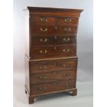 A George III mahogany chest on chest, fitted two short and six graduated long drawers with a central