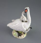 A Meissen group of a swan with cygnets, late 19th century, on a naturalistic mound base, crossed