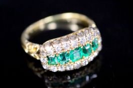 A late Victorian gold, graduated five stone emerald and diamond cluster half hoop ring, size K,