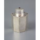 A George V Liberty & Co silver and nine stone cabochon garnet set octagonal tea caddy and cover,