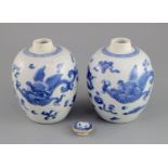 A pair of Chinese blue and white 'dragon' jars, Kangxi period, each of ovoid form, the mythical