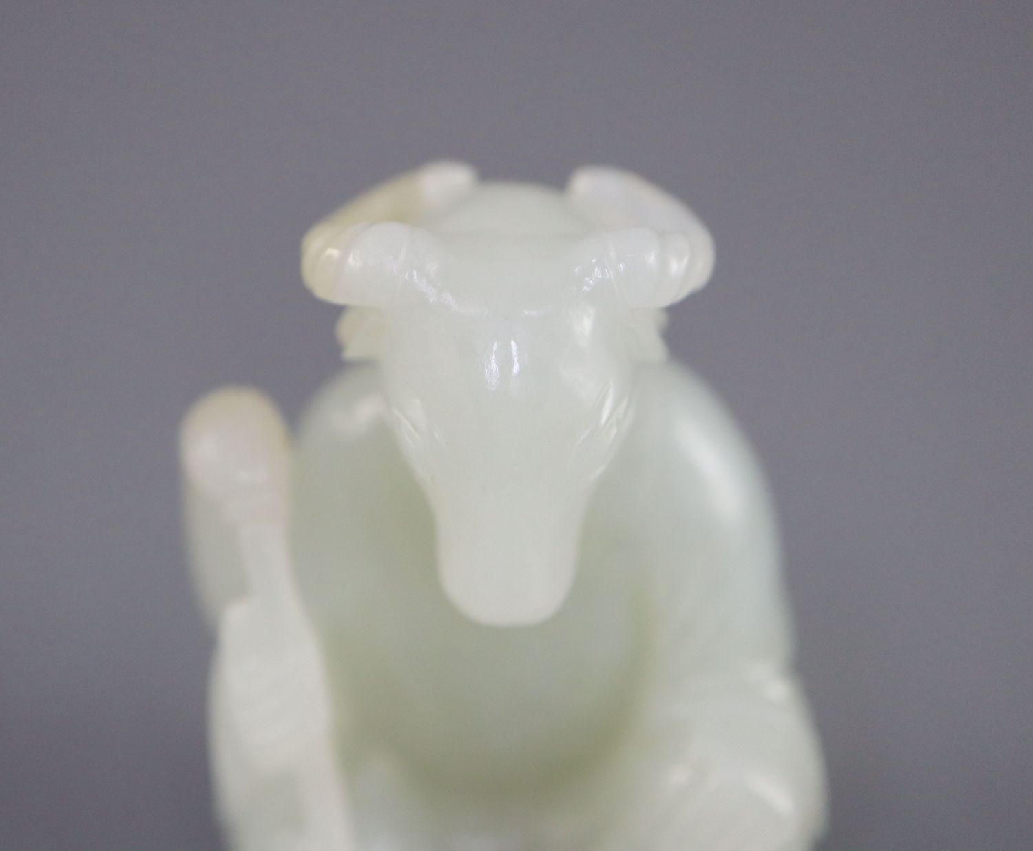 A Chinese pale celadon jade seated figure of a ram-headed immortal, seated wearing flowing robes and - Image 6 of 8