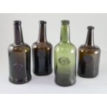 Four All Souls Common Room green glass sealed wine bottles, second half 18th century, in olive