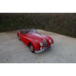 A 1956 Jaguar XK140 DHC The Jaguar XK140 was manufactured by Jaguar between 1954 and 1957 as the