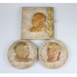 After the antique. A pair of early 19th century Italian marble roundels, carved with the heads of