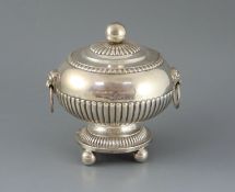 An early 19th century Anglo Indian silver demi-fluted silver circular vegetable tureen and cover,