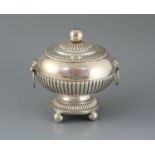 An early 19th century Anglo Indian silver demi-fluted silver circular vegetable tureen and cover,