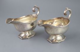 A pair of late Victorian silver pedestal sauceboats, by Roskell, Roskell & Hunt, with gadrooned