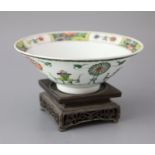 A Chinese famille verte conical shaped bowl, Kangxi period, the interior with a band of floral