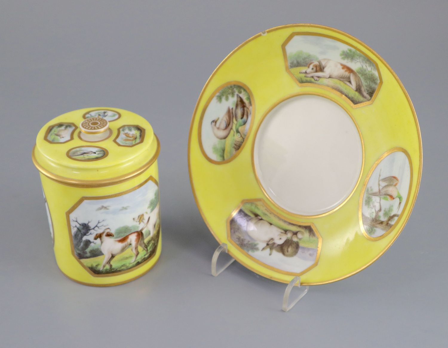 A rare Derby single handled chocolate cup, cover and stand, c.1795-1800, painted in the manner of