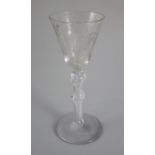 A air twist wine glass, of Jacobite significance, c.1745, the rounded funnel shaped bowl engraved