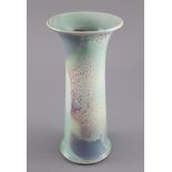 A Ruskin high fired tapering strumpet vase, dated 1909, decorated with a flambe glaze in pale