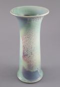 A Ruskin high fired tapering strumpet vase, dated 1909, decorated with a flambe glaze in pale