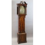 A George III mahogany eight day chiming longcase clock, the arched 12 inch brass dial with