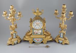 A 19th century Louis XVI style ormolu and Sevres style porcelain clock garniture, the mantel clock