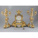 A 19th century Louis XVI style ormolu and Sevres style porcelain clock garniture, the mantel clock